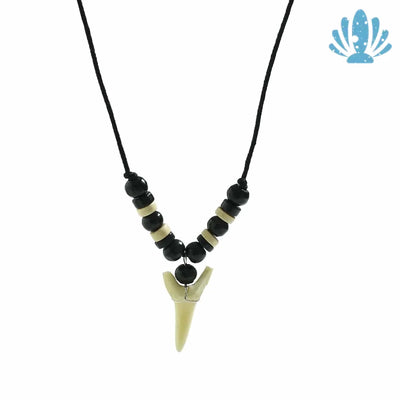Puka shell necklace with shark tooth