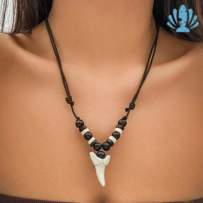 Puka shell necklace with shark tooth